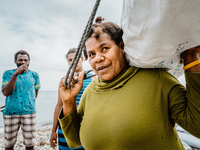 woman receiving ShelterBox shelter kit in Vanuatu after Cyclone Harold