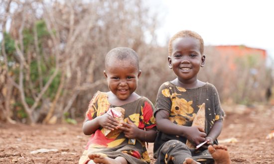 Two small boys sitting on the ground in Somalia