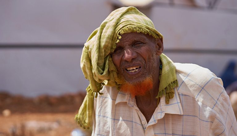 Man wearing green head scarf in Somalia