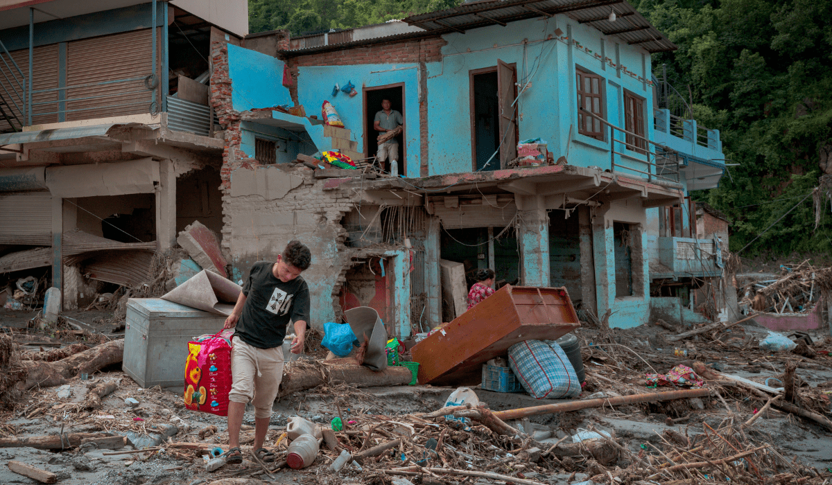 Residents salvage belongings from their destroyed home following flash floods on August 28, 2026 in Devighat, Nepal. A sudden flood swept through the Bhote Koshi River basin in northern Rasuwa on August 26, damaging settlements, roads and energy infrastructure as rescue teams searched for residents and foreign travellers reported out of contact. Hundreds were reported missing, as the death toll started to climb.